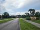 A community entrance welcomes residents and visitors with lush landscaping, palms, and a decorative entry gate at 2921 Puerta Del Sol Blvd, Kissimmee, FL 34744