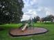 Playground featuring slides, climbing structures, and a mulch ground covering at 2921 Puerta Del Sol Blvd, Kissimmee, FL 34744