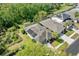 Aerial view of the home showcasing solar panels and a screened pool at 2958 Sunset Vista Blvd, Kissimmee, FL 34747