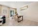 Bright dining area featuring a wooden table with seating for four, and sliding glass doors at 2958 Sunset Vista Blvd, Kissimmee, FL 34747