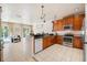 Spacious kitchen featuring stainless steel appliances, granite countertops, and an open layout at 2958 Sunset Vista Blvd, Kissimmee, FL 34747