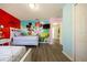 bedroom featuring cartoon themed wall decor and two beds with matching linens at 561 Las Fuentes Dr, Kissimmee, FL 34747