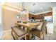 Comfortable dining area featuring a wooden table with seating and a modern pendant light at 561 Las Fuentes Dr, Kissimmee, FL 34747