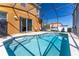 Inviting screened-in pool with chairs for relaxation at 561 Las Fuentes Dr, Kissimmee, FL 34747