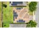 Aerial view of a home featuring a solar-paneled roof and a well-maintained yard at 624 Sardinia Circle, Davenport, FL 33837