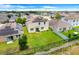 Aerial view of a spacious backyard featuring a well-maintained lawn and a fence at 624 Sardinia Circle, Davenport, FL 33837