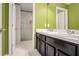 Bathroom featuring a double sink vanity and a shower at 624 Sardinia Circle, Davenport, FL 33837