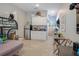 Living area featuring tiled floors, a kitchenette, and a bunkbed at 624 Sardinia Circle, Davenport, FL 33837