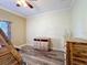 Empty bedroom featuring wood floors, natural light, and neutral color palette at 657 Shorehaven Dr, Poinciana, FL 34759