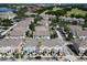 Bird's eye view showcases colorful townhomes and a nearby golf course, creating an inviting community atmosphere at 6659 Times Square Ave 38-103 # Orlando, Orlando, FL 32835