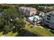 Stunning aerial view of the condo community with a sparkling pool and lush landscaping at 6659 Times Square Ave 38-103 # Orlando, Orlando, FL 32835