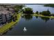 Scenic aerial view of the community lake with a fountain, surrounded by well-maintained grounds and condos at 6659 Times Square Ave 38-103 # Orlando, Orlando, FL 32835