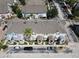 A detailed aerial shot displays a row of charming townhomes with well-kept exteriors and neat landscaping at 6659 Times Square Ave 38-103 # Orlando, Orlando, FL 32835