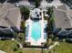 Overhead view of community pool area with many chairs, landscaping and a pool house at 6659 Times Square Ave 38-103 # Orlando, Orlando, FL 32835