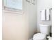 Half bathroom featuring a white toilet, modern fixtures, and neutral wall paint at 6659 Times Square Ave 38-103 # Orlando, Orlando, FL 32835