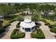 An aerial view captures a quaint gazebo nestled amidst a beautifully landscaped community park at 6659 Times Square Ave 38-103 # Orlando, Orlando, FL 32835