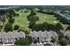 Scenic view of lush golf course and condominium complex, perfect for golf enthusiasts and nature lovers at 6659 Times Square Ave 38-103 # Orlando, Orlando, FL 32835