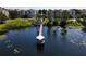 Picturesque lake pier with gazebo, enhancing the community's charm and providing a peaceful retreat at 6659 Times Square Ave 38-103 # Orlando, Orlando, FL 32835