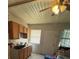 Cozy kitchen featuring natural wood cabinets, and a ceiling fan at 722 Belair Ave, Lakeland, FL 33801