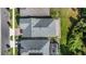 An aerial shot displays roof, driveway and backyard at 7465 Wing Span Way, Harmony, FL 34773