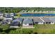 Aerial view of home with a screened-in patio and adjacent pond at 7465 Wing Span Way, Harmony, FL 34773