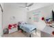 Cozy bedroom featuring a ceiling fan and a bright window at 7465 Wing Span Way, Harmony, FL 34773