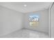 Inviting bedroom with marble floors and a window with neighborhood views at 101 Sail Way, Kissimmee, FL 34759