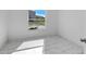 Cozy bedroom with marble flooring and a window overlooking the neighborhood at 101 Sail Way, Kissimmee, FL 34759