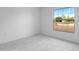 Bright bedroom featuring tiled floors and a large window offering an inviting view at 101 Sail Way, Kissimmee, FL 34759