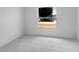 Bright bedroom featuring tiled floors and a large window offering an inviting view at 101 Sail Way, Kissimmee, FL 34759