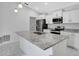 Modern kitchen featuring granite countertops, stainless steel appliances, and ample cabinet space at 101 Sail Way, Kissimmee, FL 34759