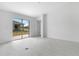Living room with sleek white tile flooring, and sliding glass doors letting in ample natural light at 101 Sail Way, Kissimmee, FL 34759