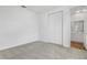Carpeted bedroom with closet and access to the bathroom at 1027 Wisteria Way, Dundee, FL 33838