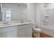 Bathroom featuring white double sink vanity and a bathtub and shower combo at 1031 Wisteria Way, Dundee, FL 33838