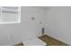 Laundry room featuring tile flooring and washer and dryer hookups with storage at 1031 Wisteria Way, Dundee, FL 33838