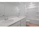 Bathroom featuring double sinks, modern lighting, and a shower-tub combo at 1035 Wisteria Way, Dundee, FL 33838