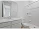 Bathroom featuring a single sink vanity and a walk-in shower at 1035 Wisteria Way, Dundee, FL 33838