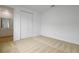 Bright bedroom featuring neutral carpeting and a double door closet at 1035 Wisteria Way, Dundee, FL 33838