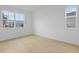 A bright bedroom featuring neutral wall paint and beautiful floors at 1035 Wisteria Way, Dundee, FL 33838