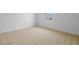 Bedroom featuring carpet flooring, base molding, and a bright window at 1035 Wisteria Way, Dundee, FL 33838