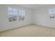 Inviting bedroom with cozy carpet flooring and a bright window at 1035 Wisteria Way, Dundee, FL 33838
