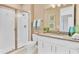 Contemporary bathroom featuring a glass-enclosed shower, white cabinets, and modern fixtures at 1039 Wisteria Way, Dundee, FL 33838