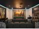 Entertainment basement with home theater, custom wall art and gaming and lounge areas at 1057 Castle Pines Ct, Reunion, FL 34747