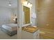 Bathroom with vanity and shower/tub combo, adjoined to a bedroom at 1057 Castle Pines Ct, Reunion, FL 34747