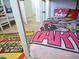 Close-up view of the lower bunk of the themed bed featuring comic-themed bedding at 1057 Castle Pines Ct, Reunion, FL 34747
