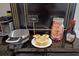 Charming coffee bar showcasing a waffle maker, pancake mix, and syrup for breakfast delights at 1057 Castle Pines Ct, Reunion, FL 34747