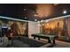 Entertainment room with a pool table and custom Star Wars themed wall art, and classic arcade machine at 1057 Castle Pines Ct, Reunion, FL 34747