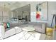 Cozy living room with sectional couch, modern decor and nearby kitchen access at 1057 Castle Pines Ct, Reunion, FL 34747