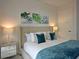 Comfortable main bedroom featuring large windows, a plush king bed, and a serene decor at 1057 Castle Pines Ct, Reunion, FL 34747