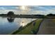 Scenic pond view with a beautiful golf course backdrop and majestic birds at 1057 Castle Pines Ct, Reunion, FL 34747